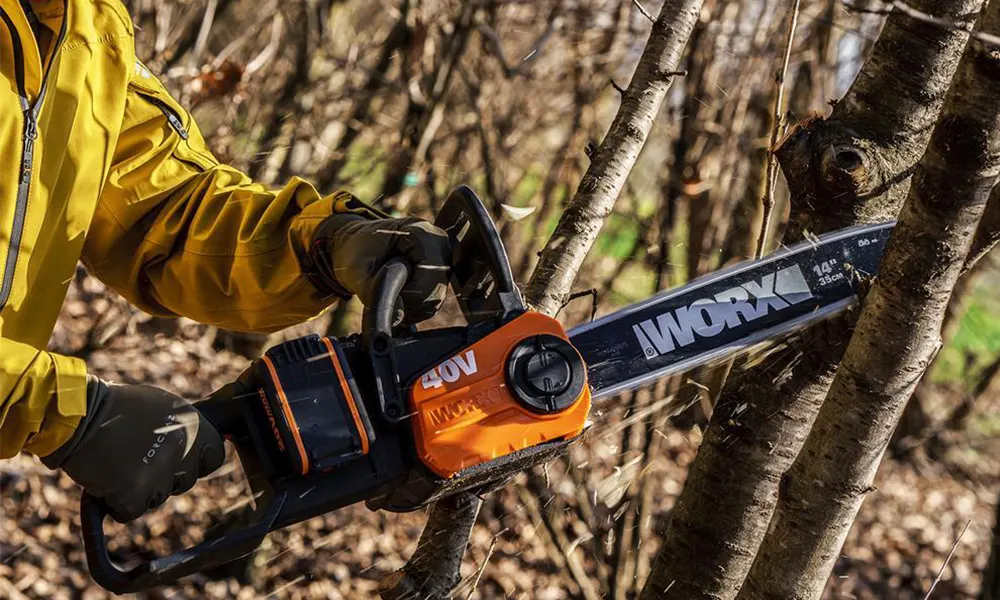 Placeholder for a WORX cordless chainsaw processing firewood